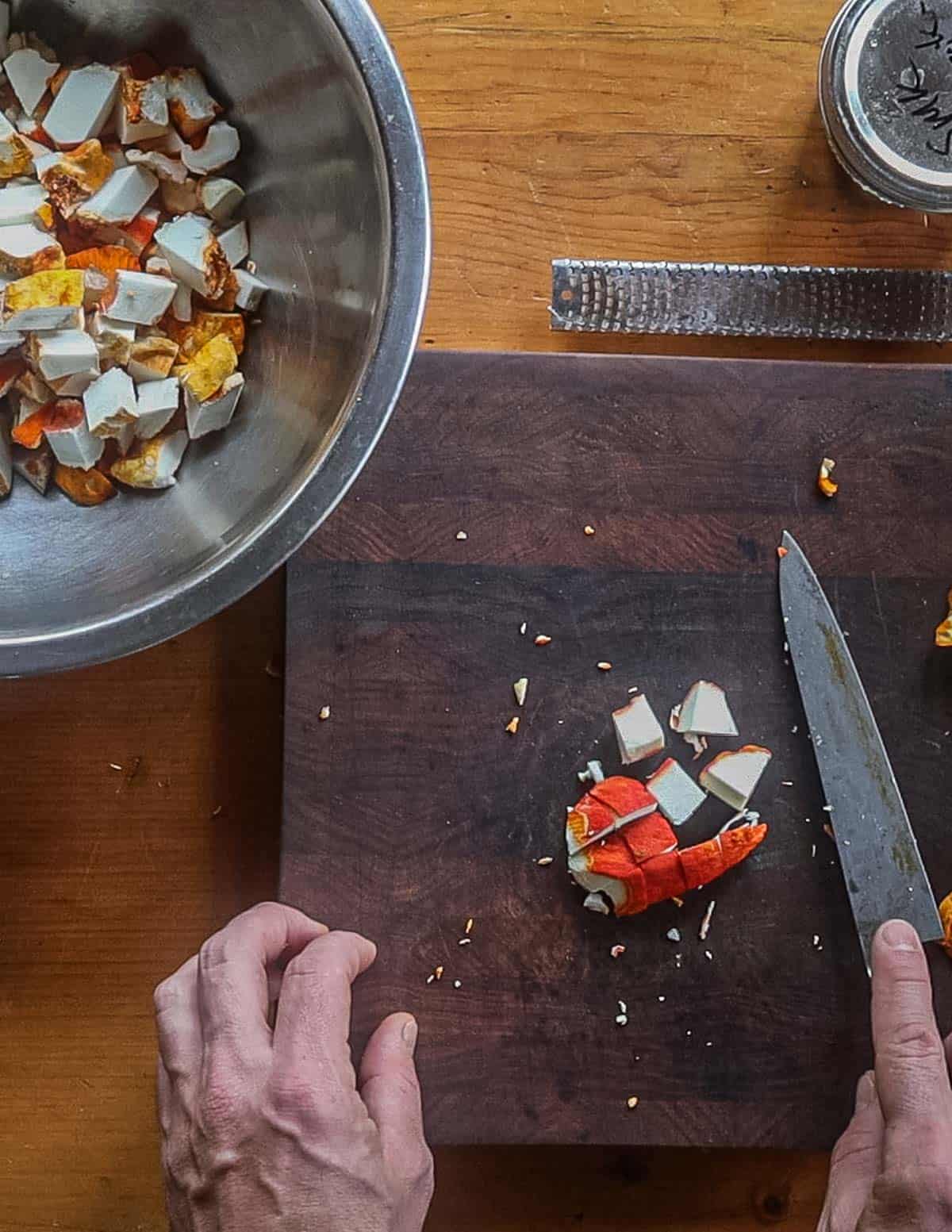 Dicing lobster mushrooms into cubes. 