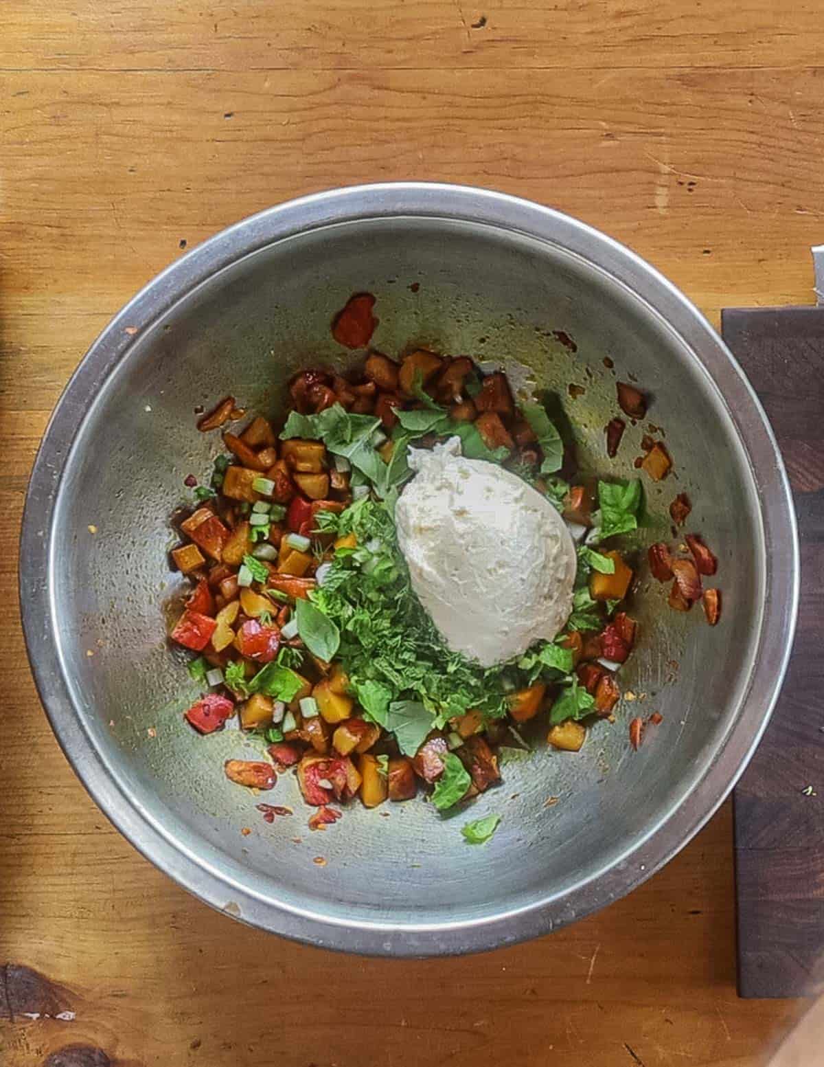 Adding mayonnaise to mushroom salad in a bowl. 