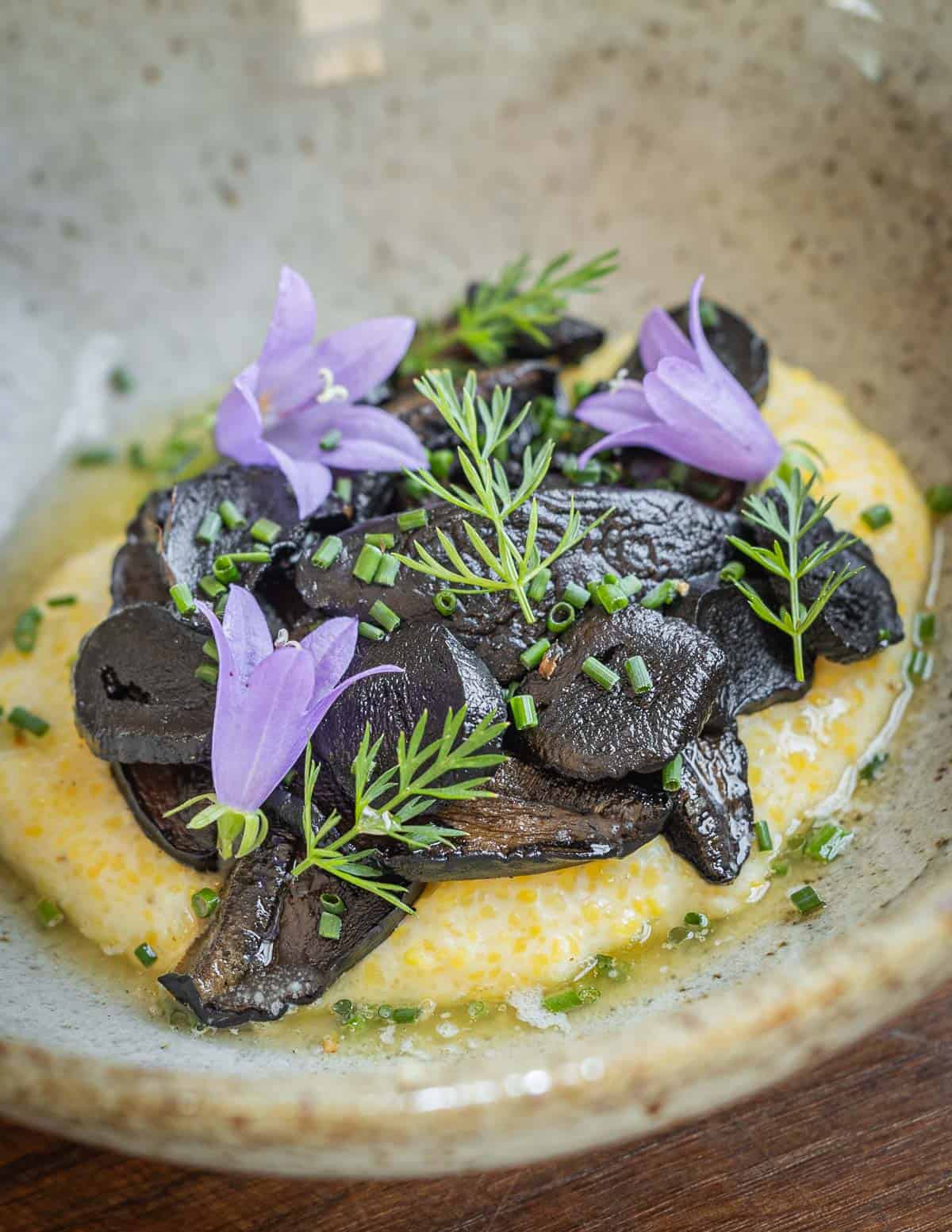 Sauteed mushrooms on a bed of cheesy polenta. 