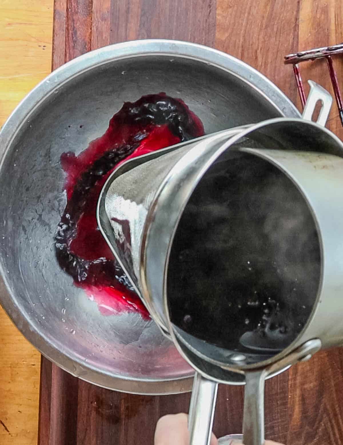 Straining aronia juice. 