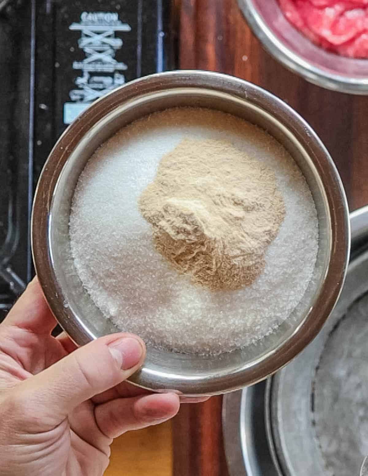 Mixing pectin and sugar in a bowl. 