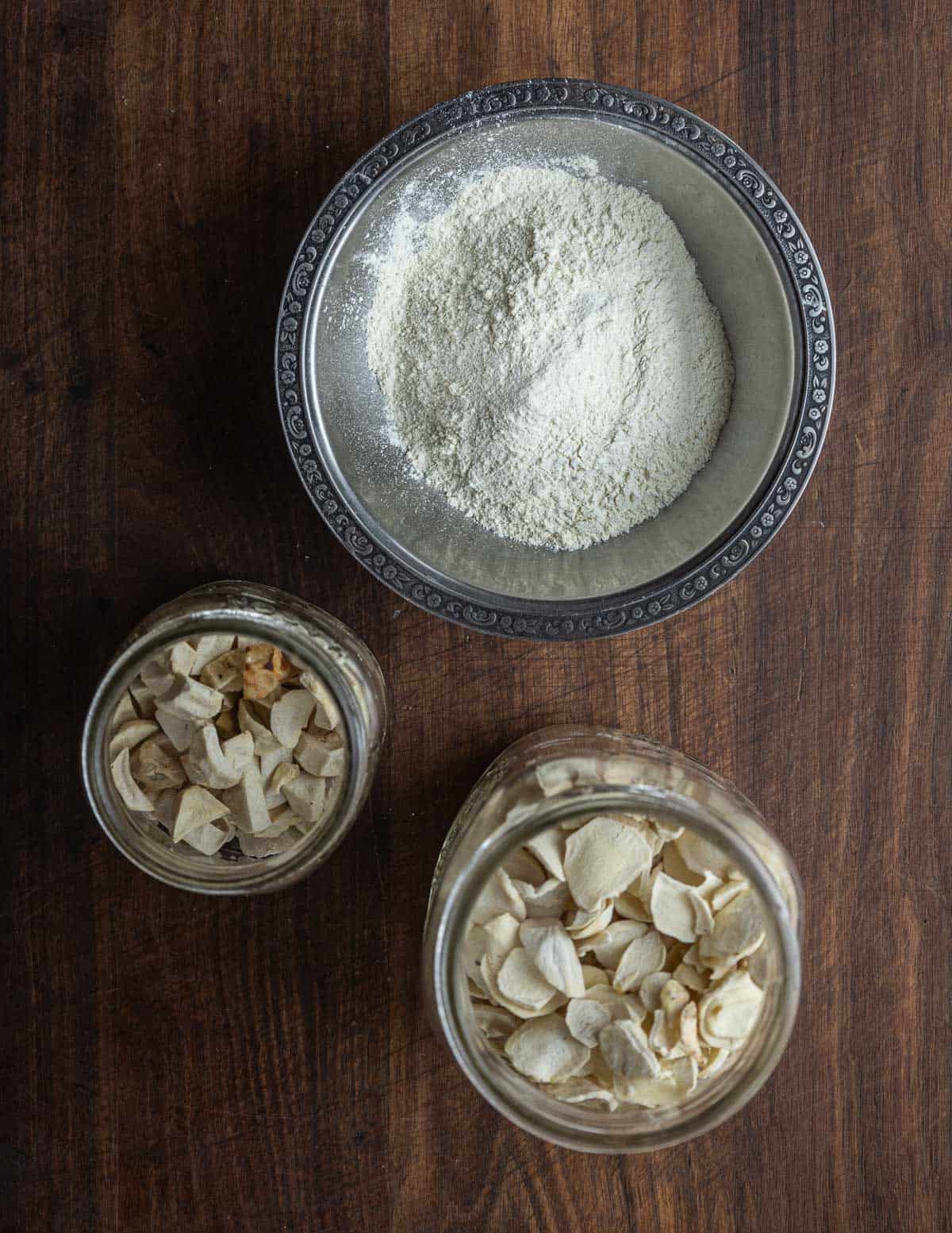A bowl of katniss flour, dried wapato tubers, and duck potato flour. 