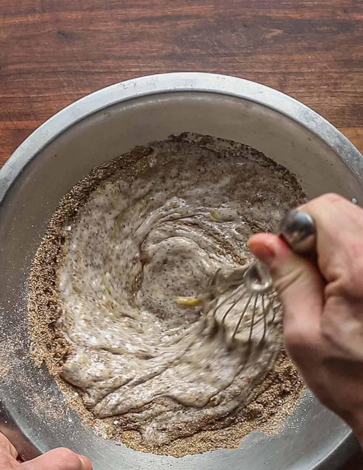 Mixing acorn flour and cornmeal with buttermilk, eggs, and melted butter. 