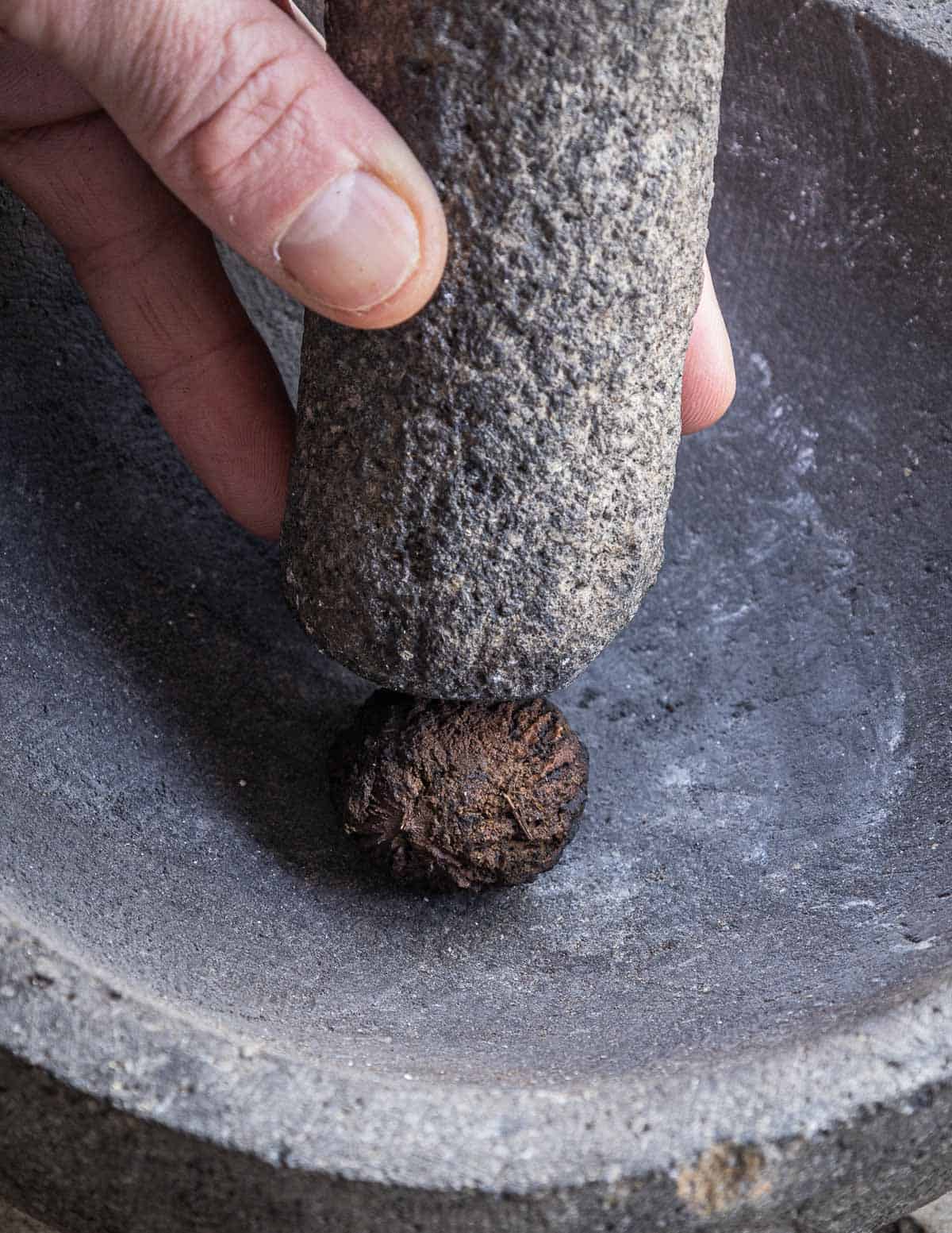 Cracking a black walnut by hand. 