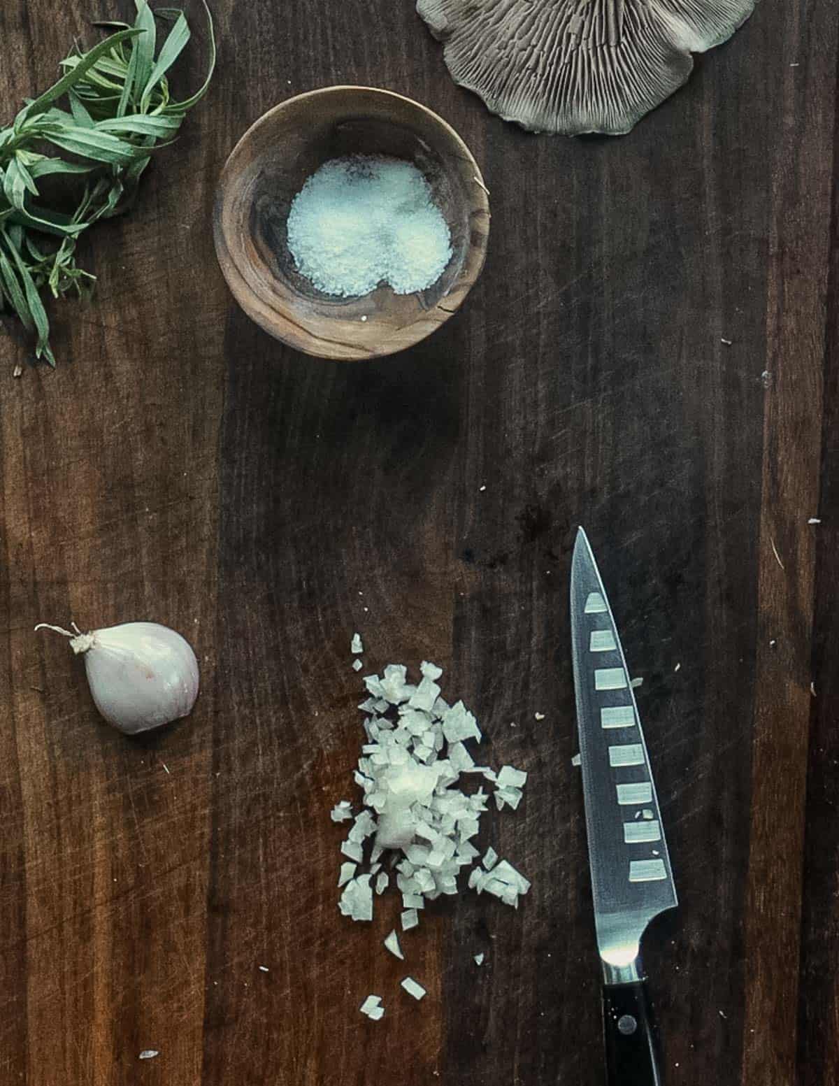 Cutting a shallot into small dice. 
