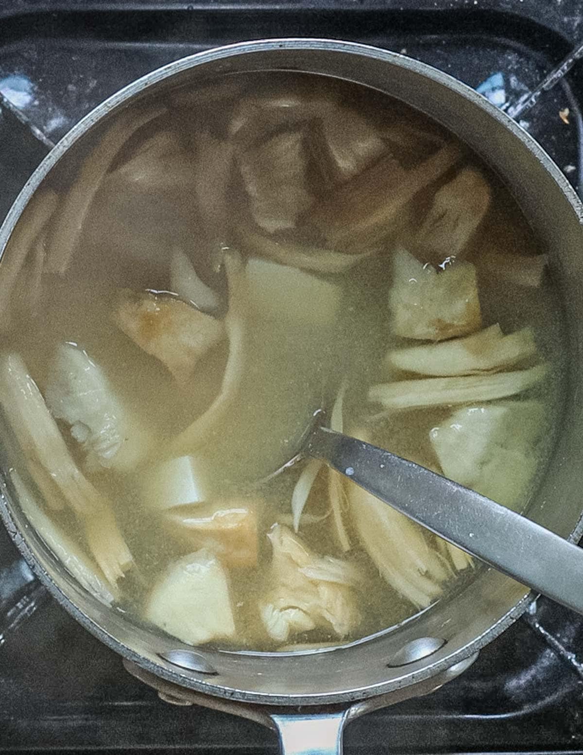 A pot of matsutake miso soup cooking. 