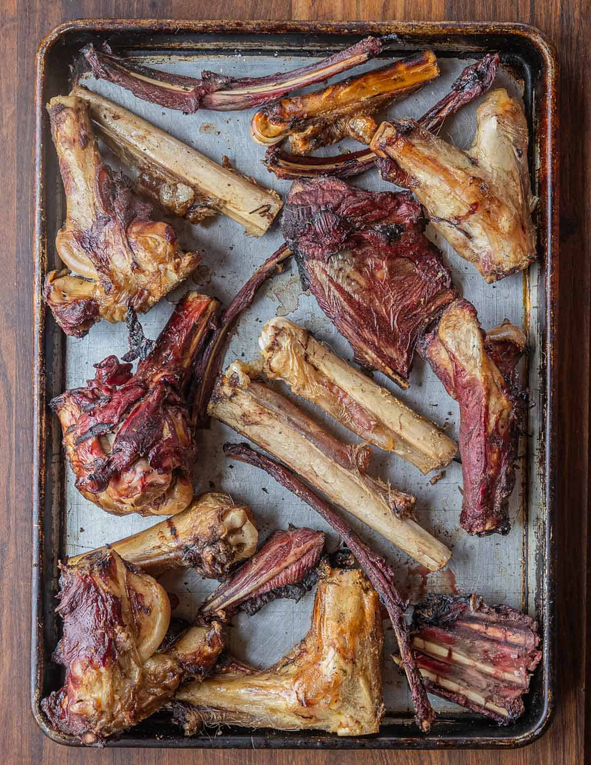A baking sheet filled with smoked venison bones for stock and deer broth. 
