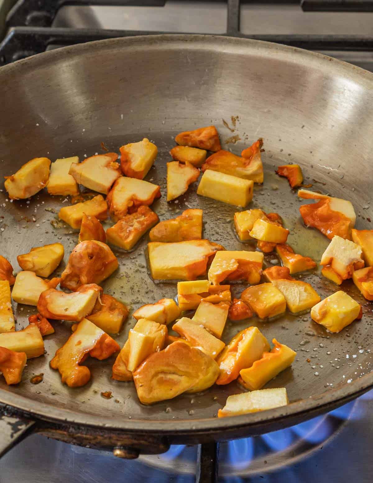 Cooking chicken of the woods mushrooms in a pan. 