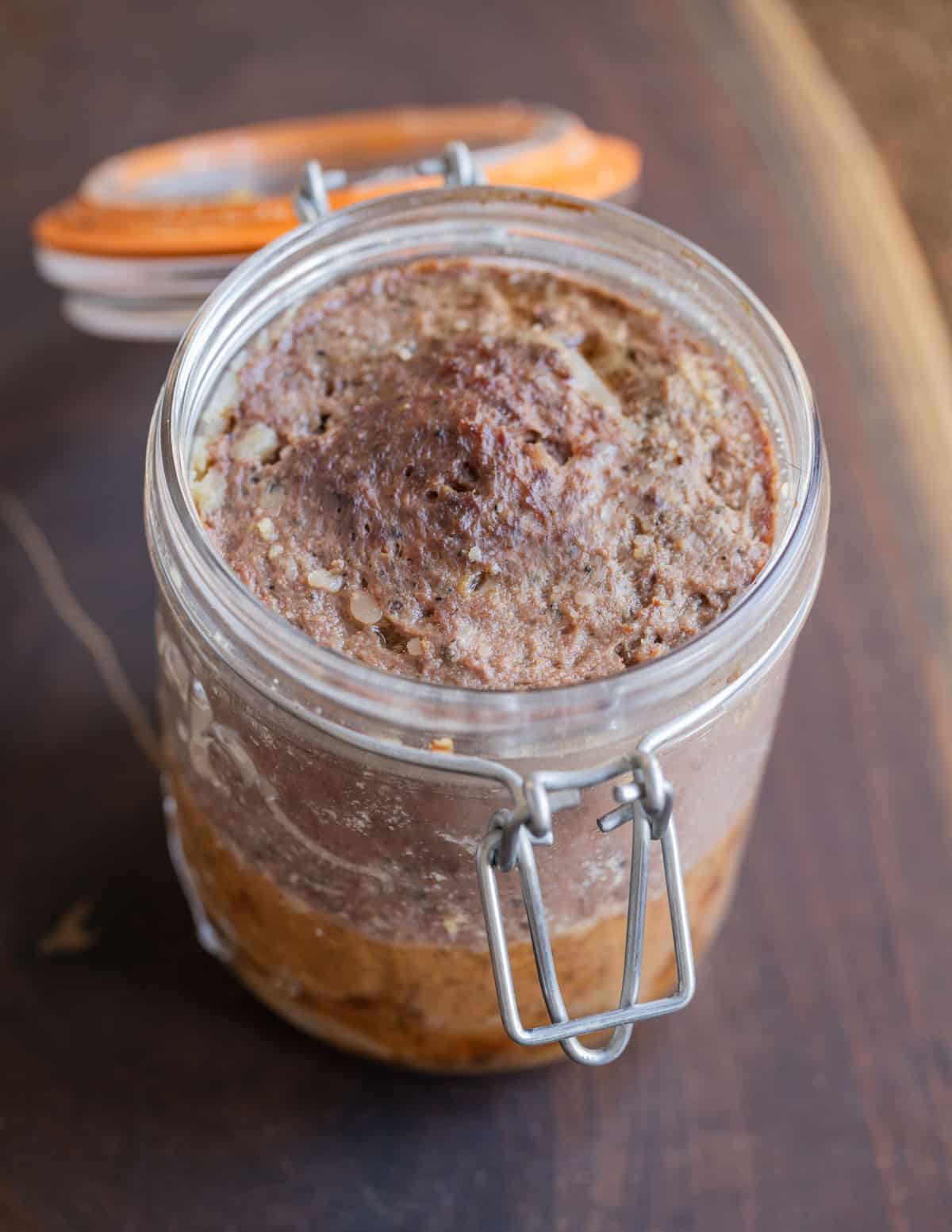 Fresh homemade braunshweiger or liverwurst in a mason jar. 