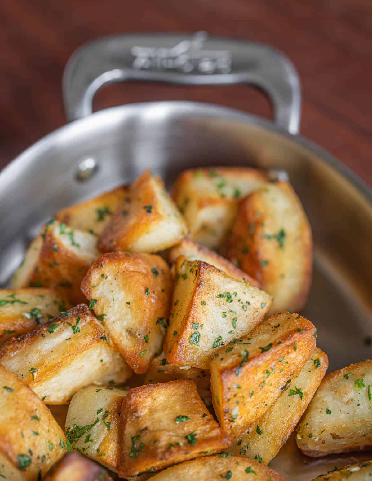 A small baking dish of roasted potatoes cooked in beef fat. 