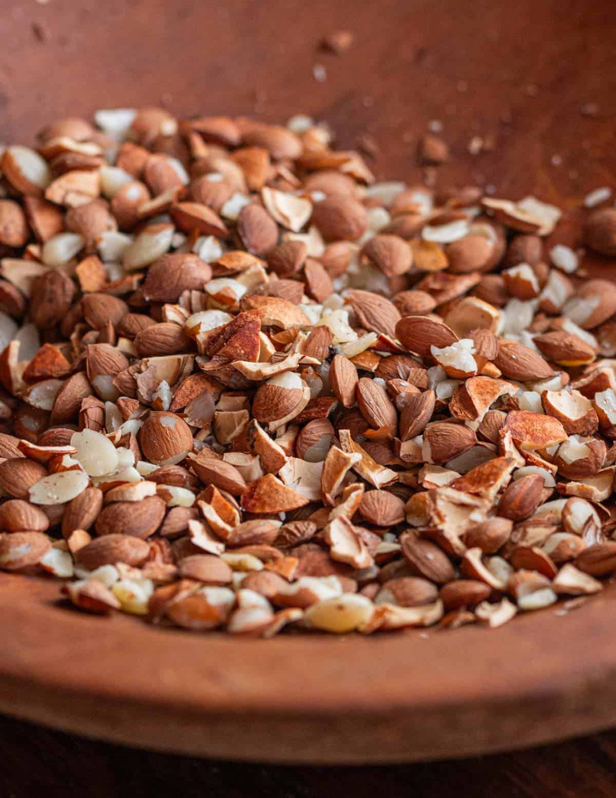 A bowl of stone fruit seeds and shells. 