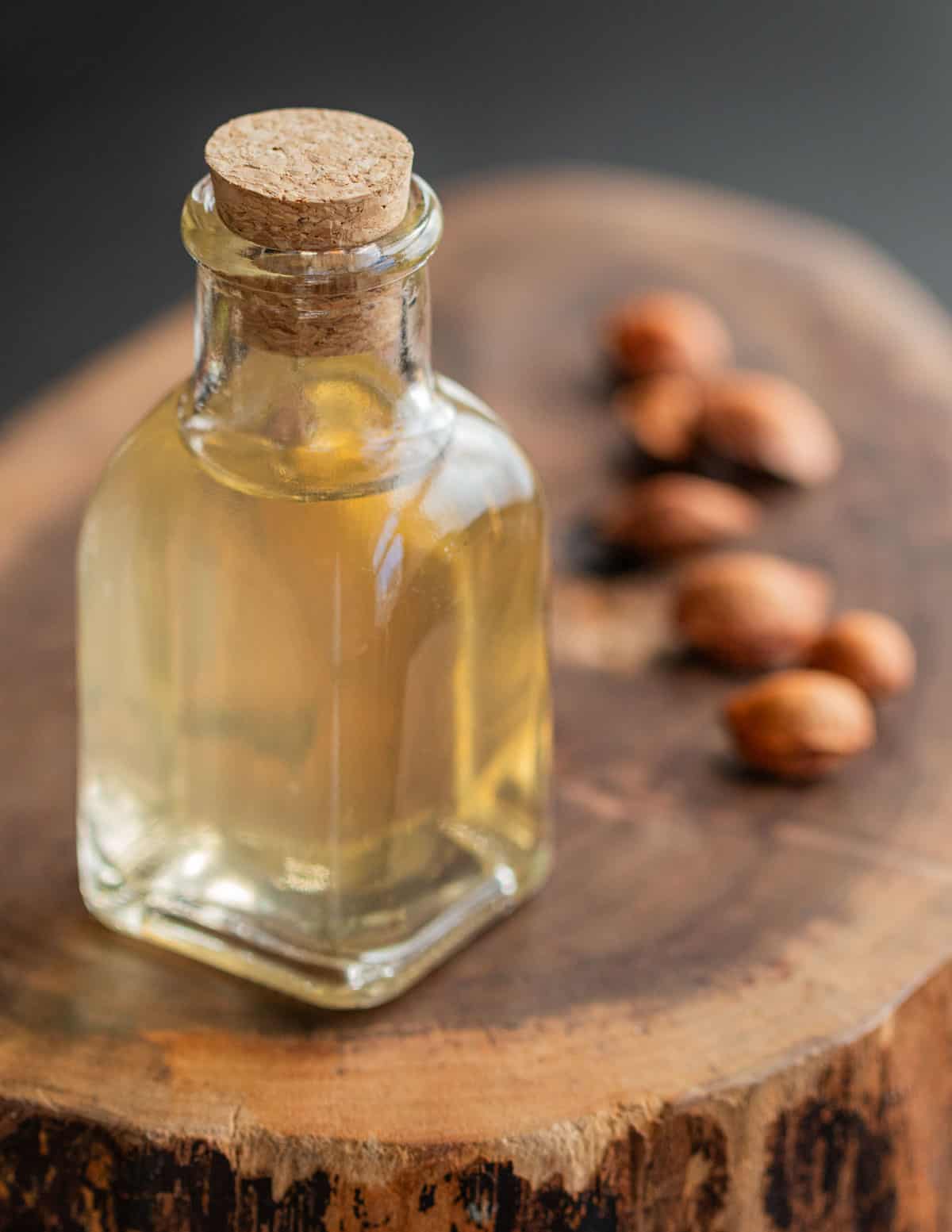 A jar of homemade almond extract or creme de noyeaux. 
