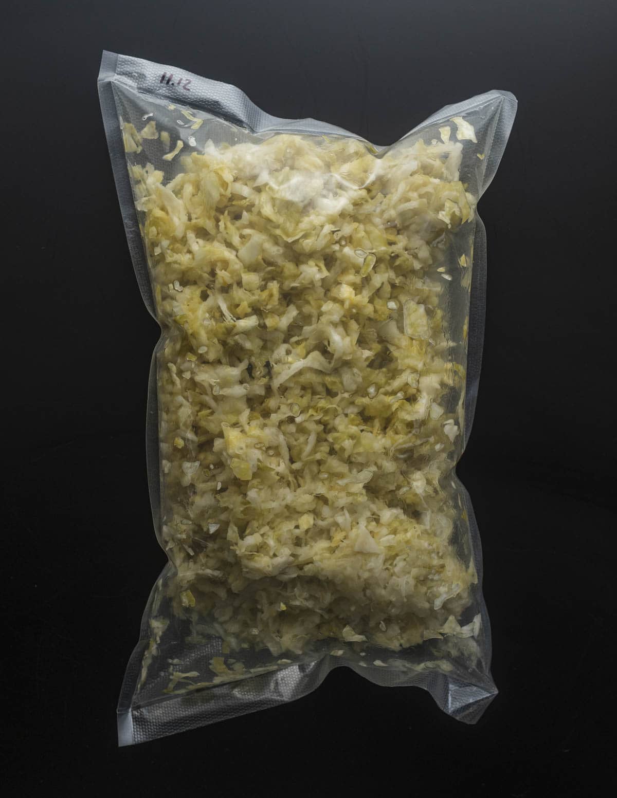cabbage fermenting into sauerkraut in a vacuum bag.