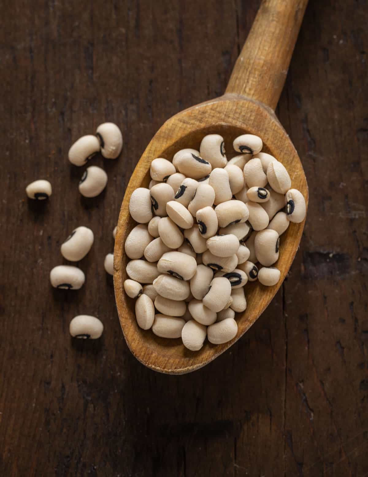 A spoonful of dried cow peas or black eyed peas. 