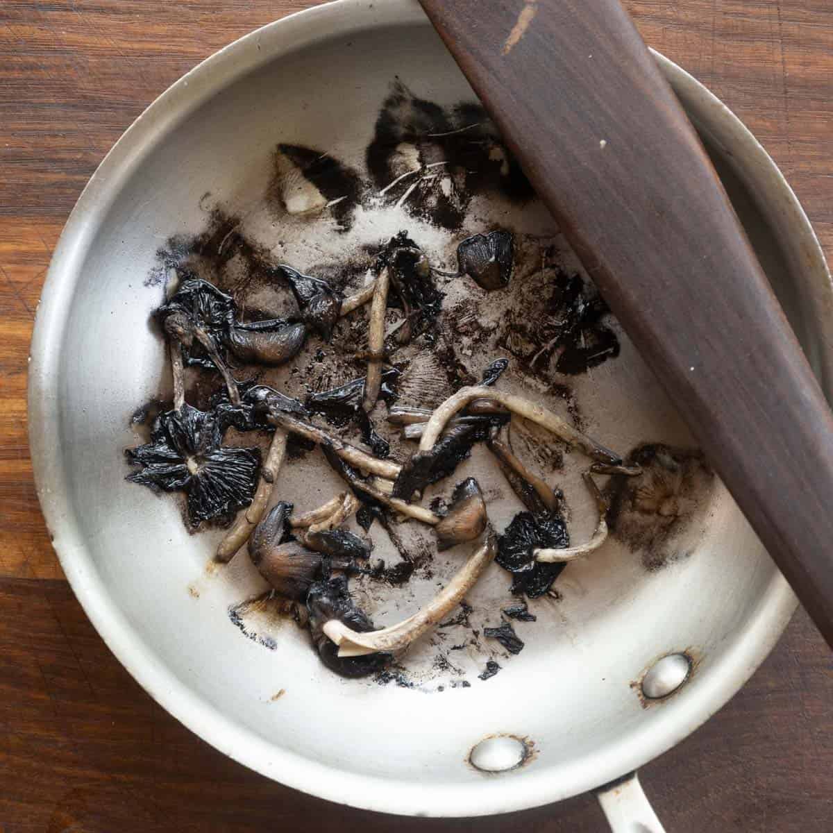 Cooking older mica cap mushroom in a pan. 