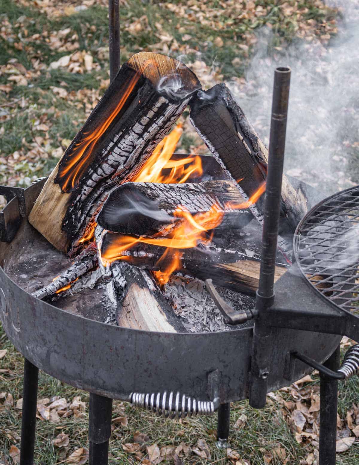 Building a wood fire in a kudu grill. 