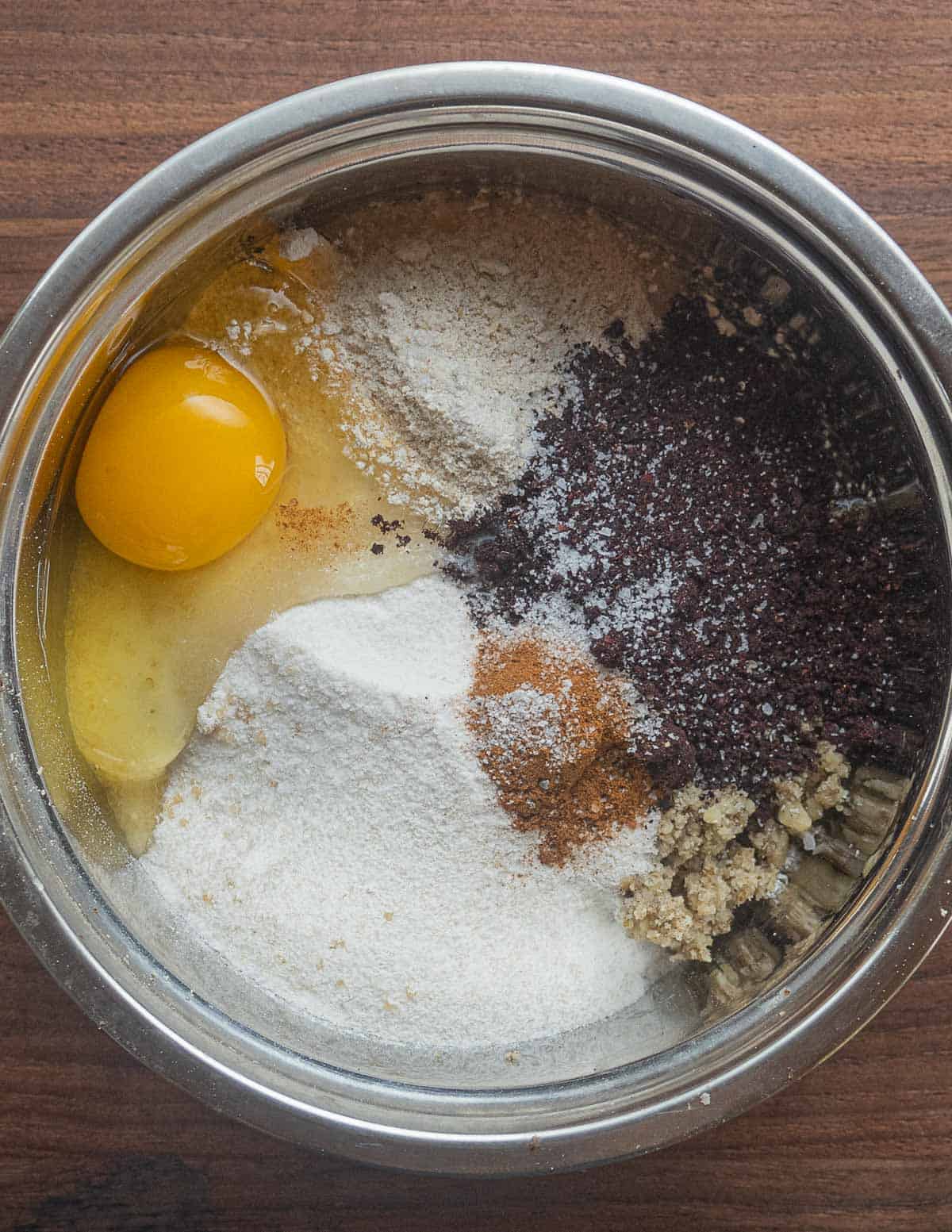 Black walnut flour, eggs, sugar, cinnamon and salt in a mixing bowl. 