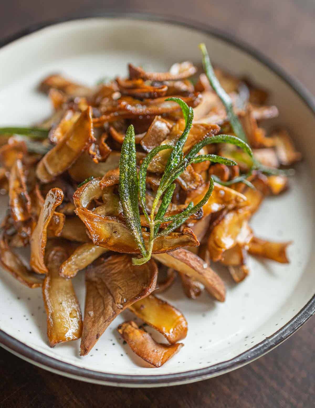 A dish of crisp fried berkeley's polypore with fried rosemary.