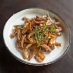 A plate full of crispy berkeley's polypore with fried rosemary.