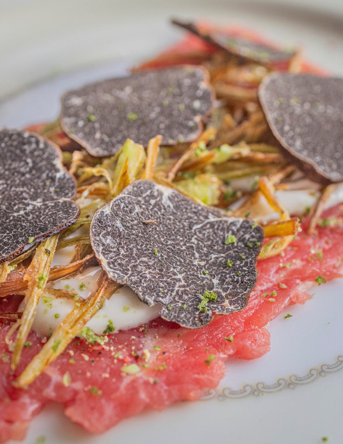 A beef carpaccio with sliced Appalachian truffles (Tuber canaliculatum).