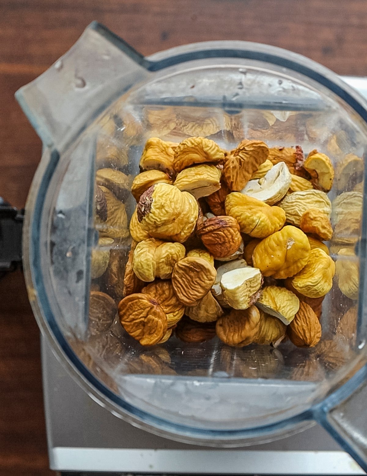 Dried chestnuts in a vitamix blender ready to grind  into flour. 