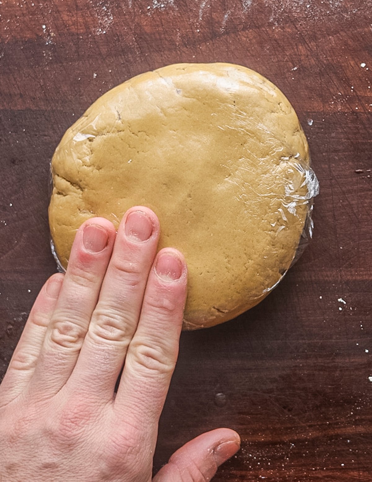 Wrapping chestnut pasta dough in cling film.