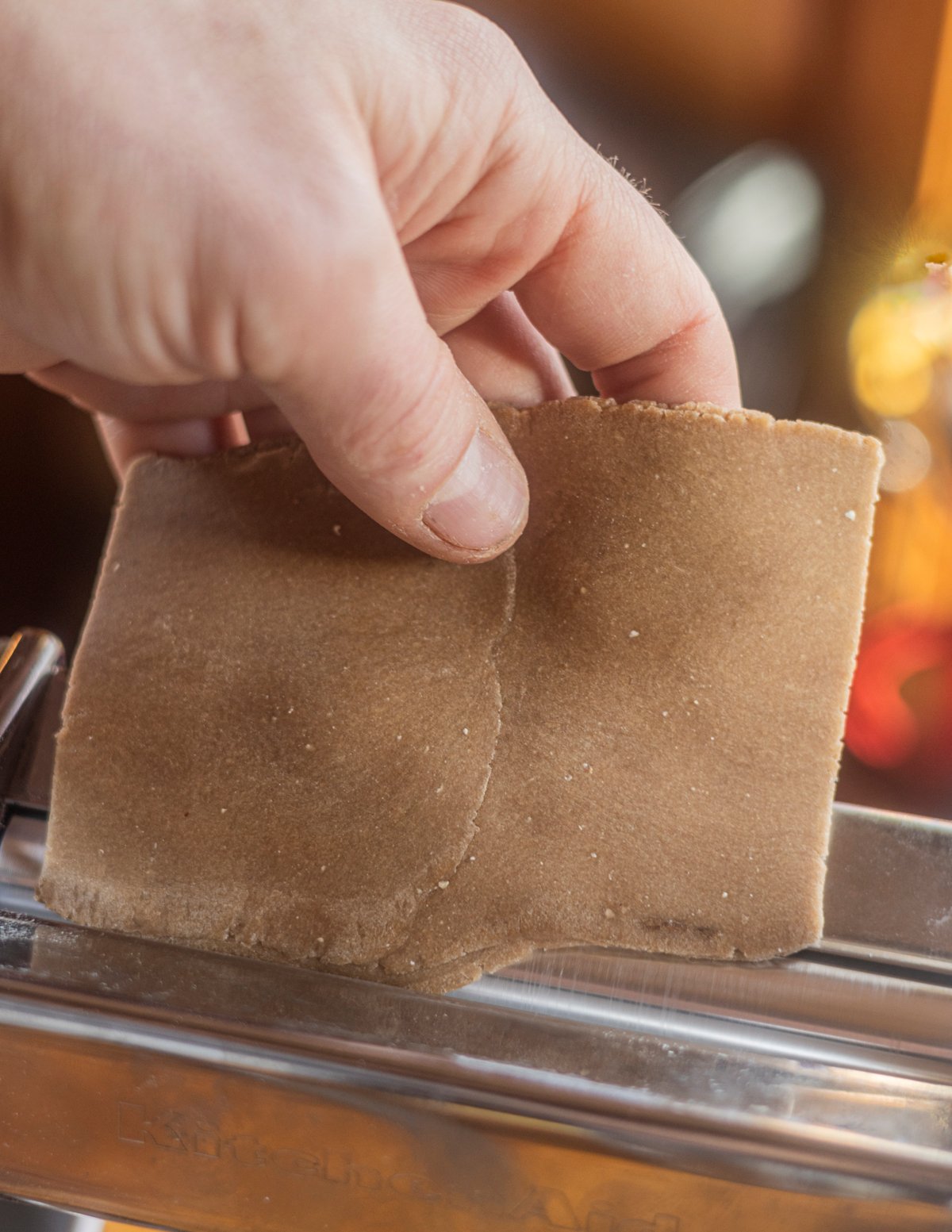 Rolling out folded chestnut pasta dough. 