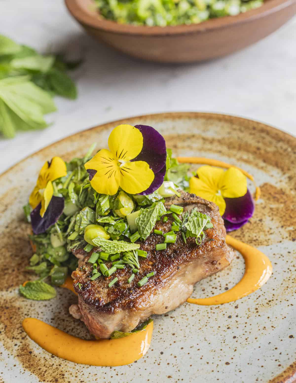 Lamb chops with a ground elder or snow on the mountain salad. 
