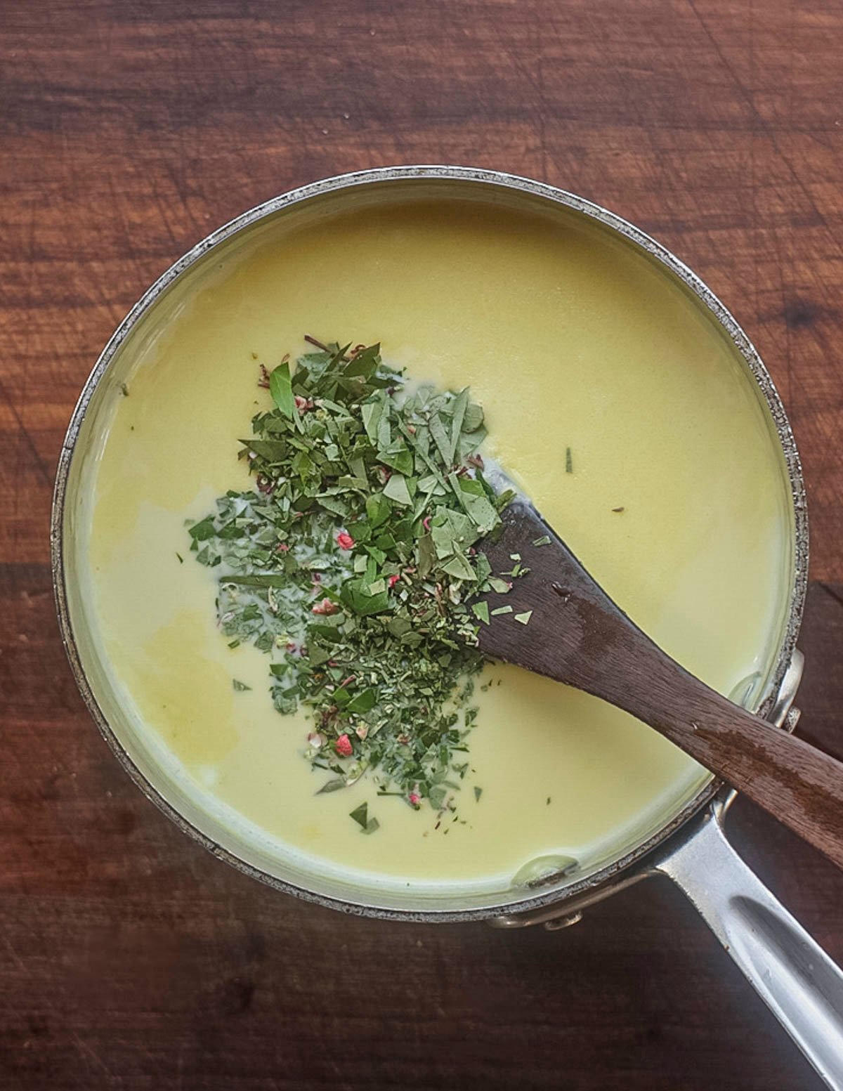 Mixing minced wintergreen or teaberry leaves into an ice cream custard after chilling. 