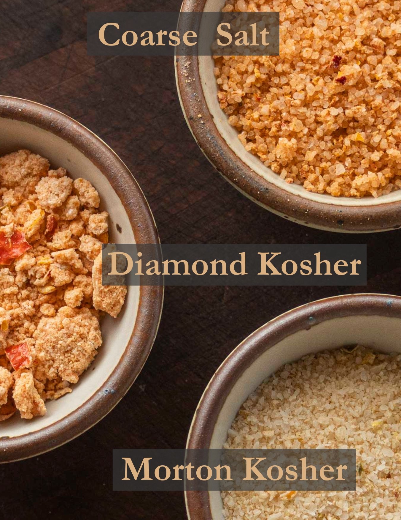 Three small bowls filled with different spicy salts made with different salt types showing differences in texture. 