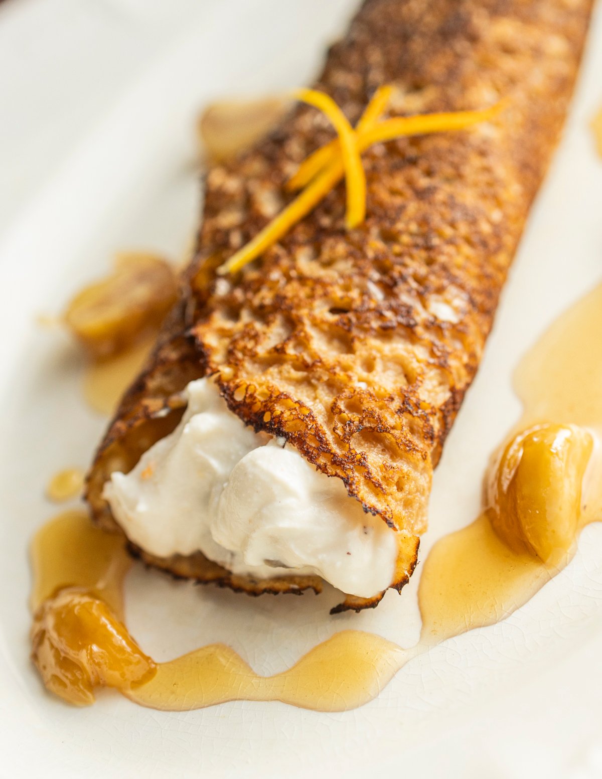 Necci Italian chestnut pancake filled with ricotta cheese chestnut filling served with chestnut honey and roasted candied chestnuts.