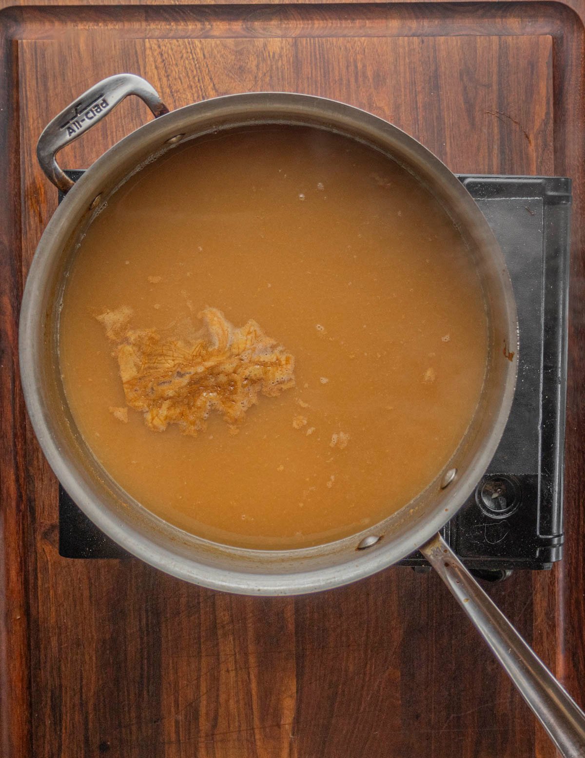 Pear juice that's been reduced by 50% in a pan. 