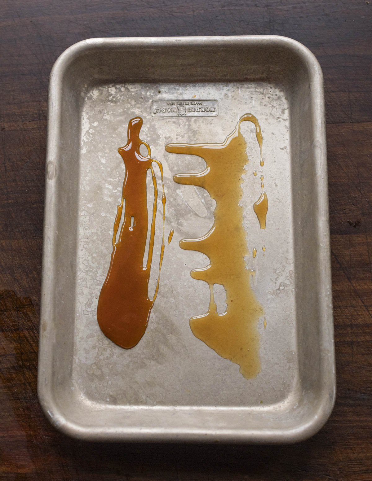 Pear syrup and pear caramel side by side on a tray. 