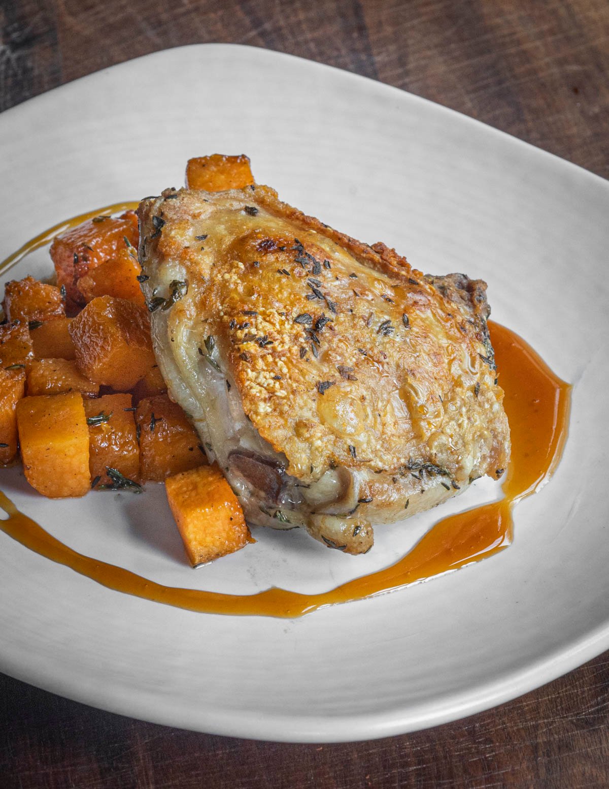 Roasted chicken thighs with sweet potatoes and a pear caramel sauce. 