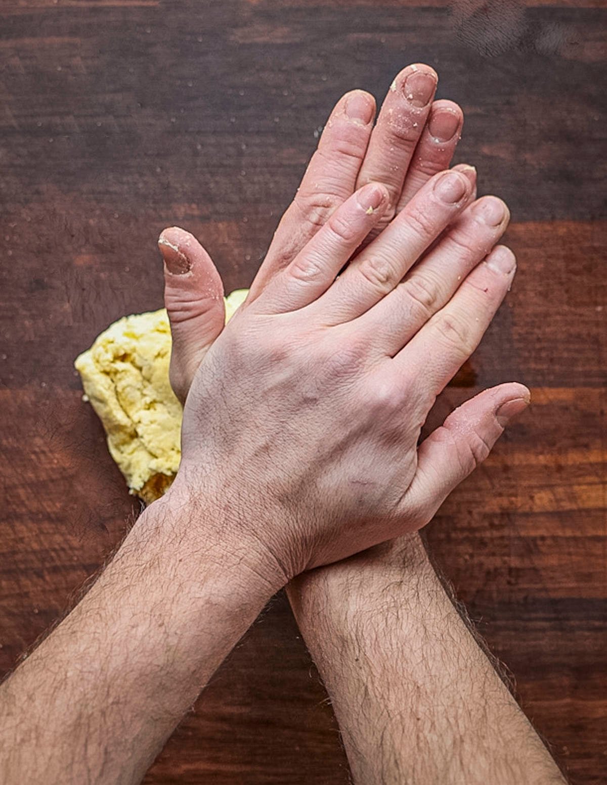 Kneading a batch of pasta dough. 