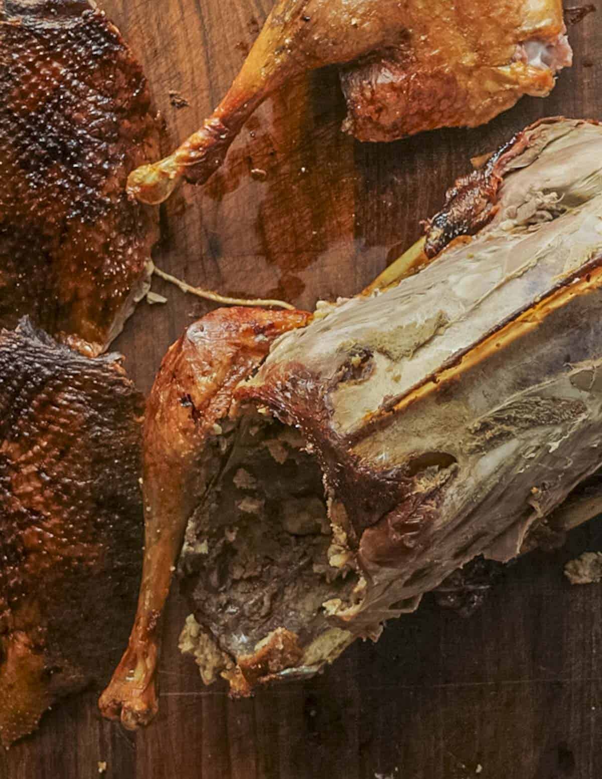 A roasted goose carcass cut up with the breasts and legs removed. 