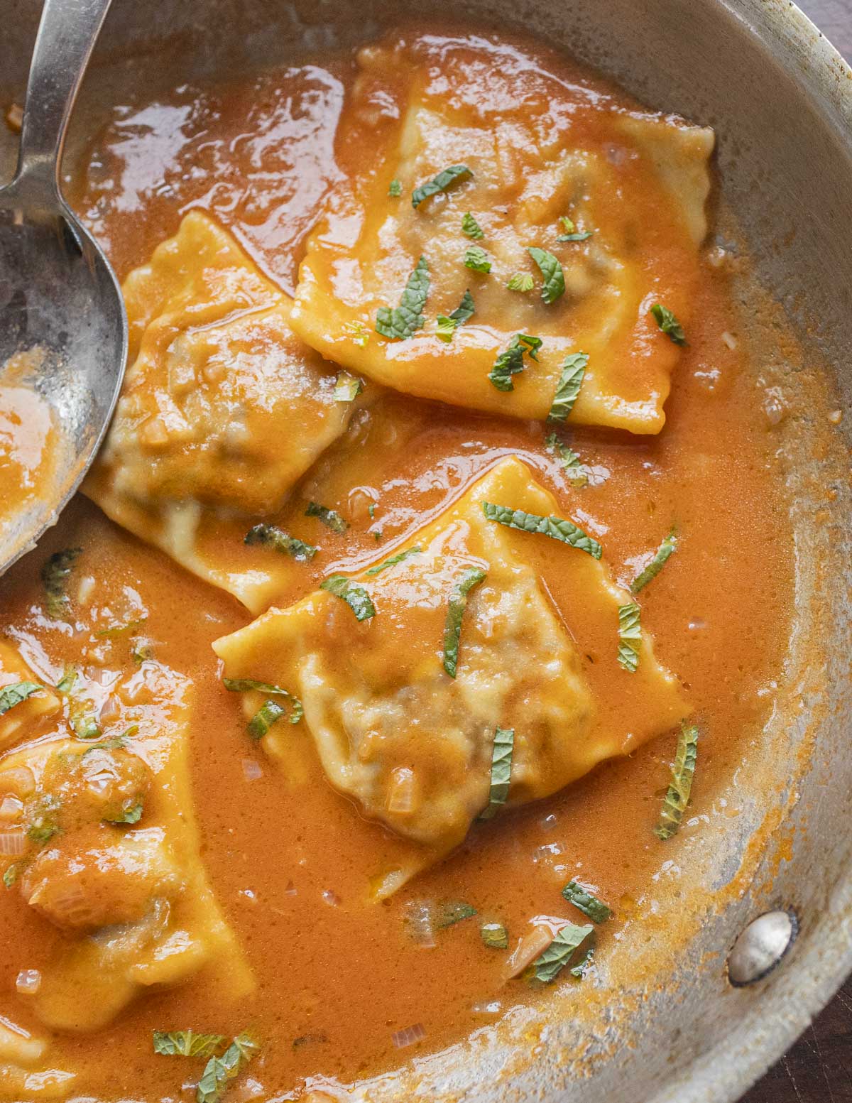 Ravioli with a tomato beer butter sauce. 