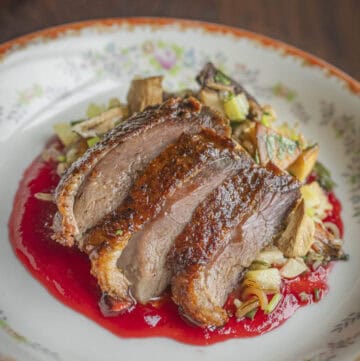 Sliced roasted goose with highbush cranberry sauce, wild rice and butternuts or white walnuts.