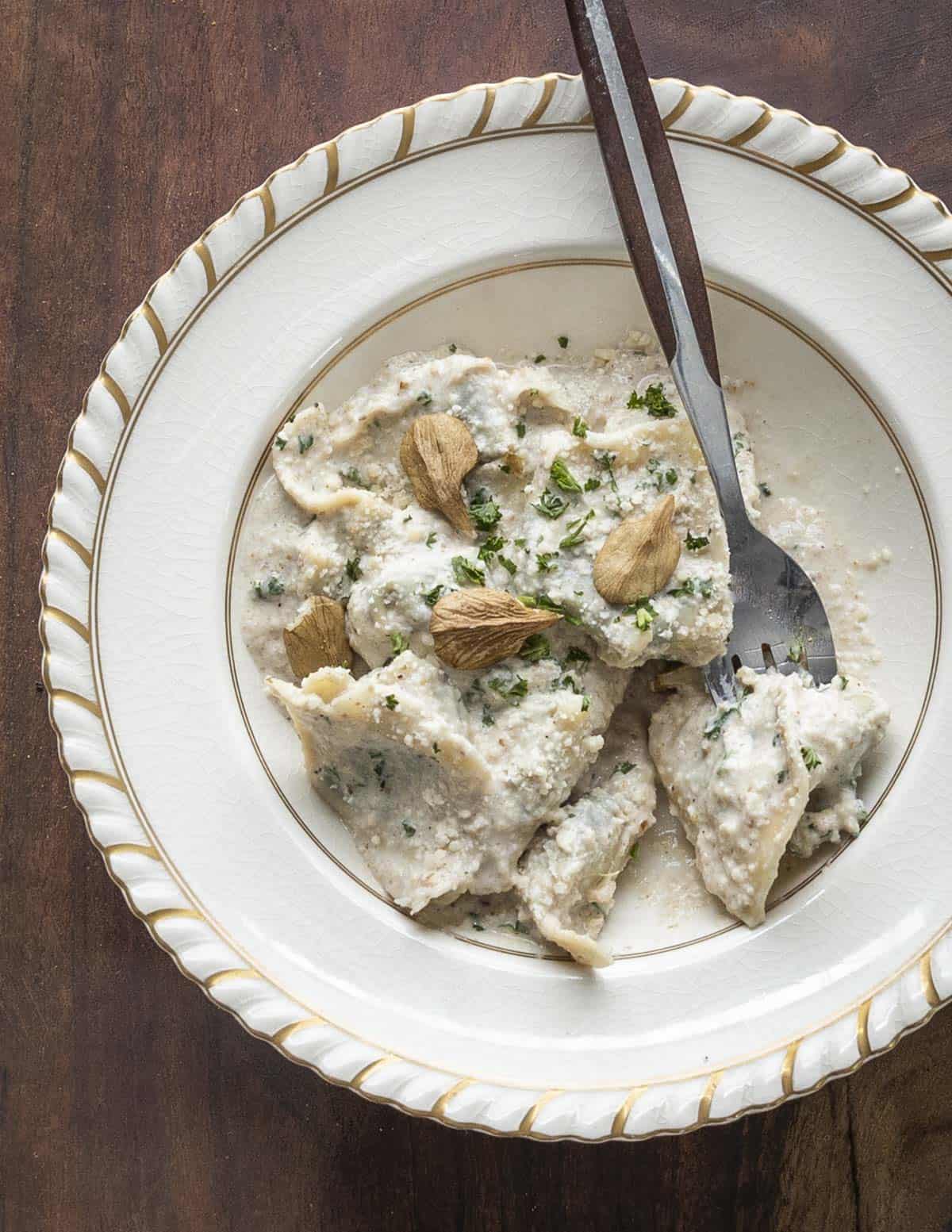 Ligurian pansotti pasta served with a walnut sauce. 