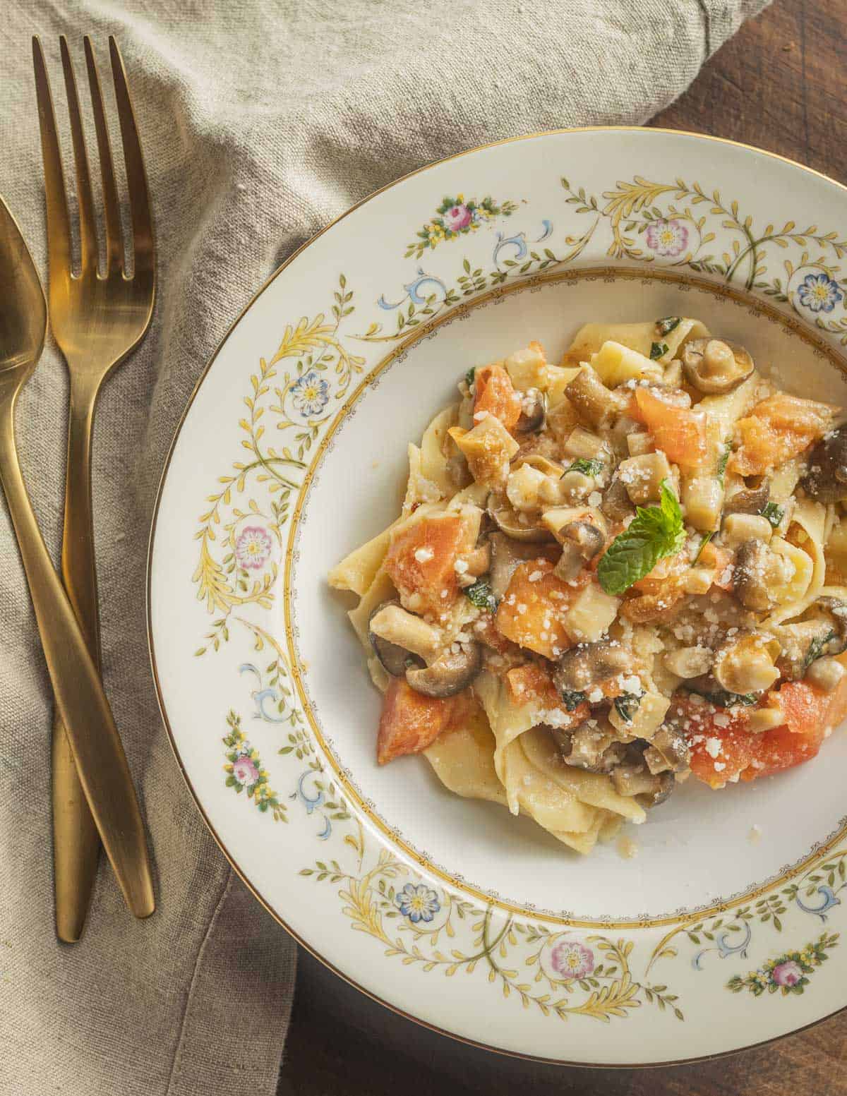 A dish of pappardelle with pioppino mushroom sauce in a bowl ready to eat. 