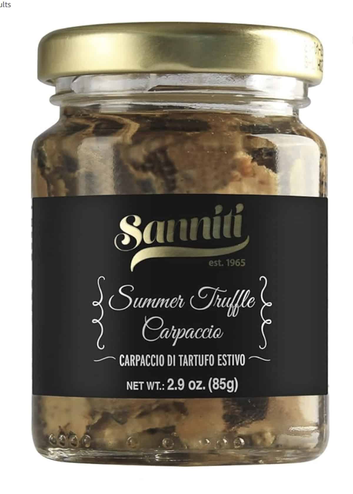 A jar of black summer truffle carpaccio preserved in oil. 