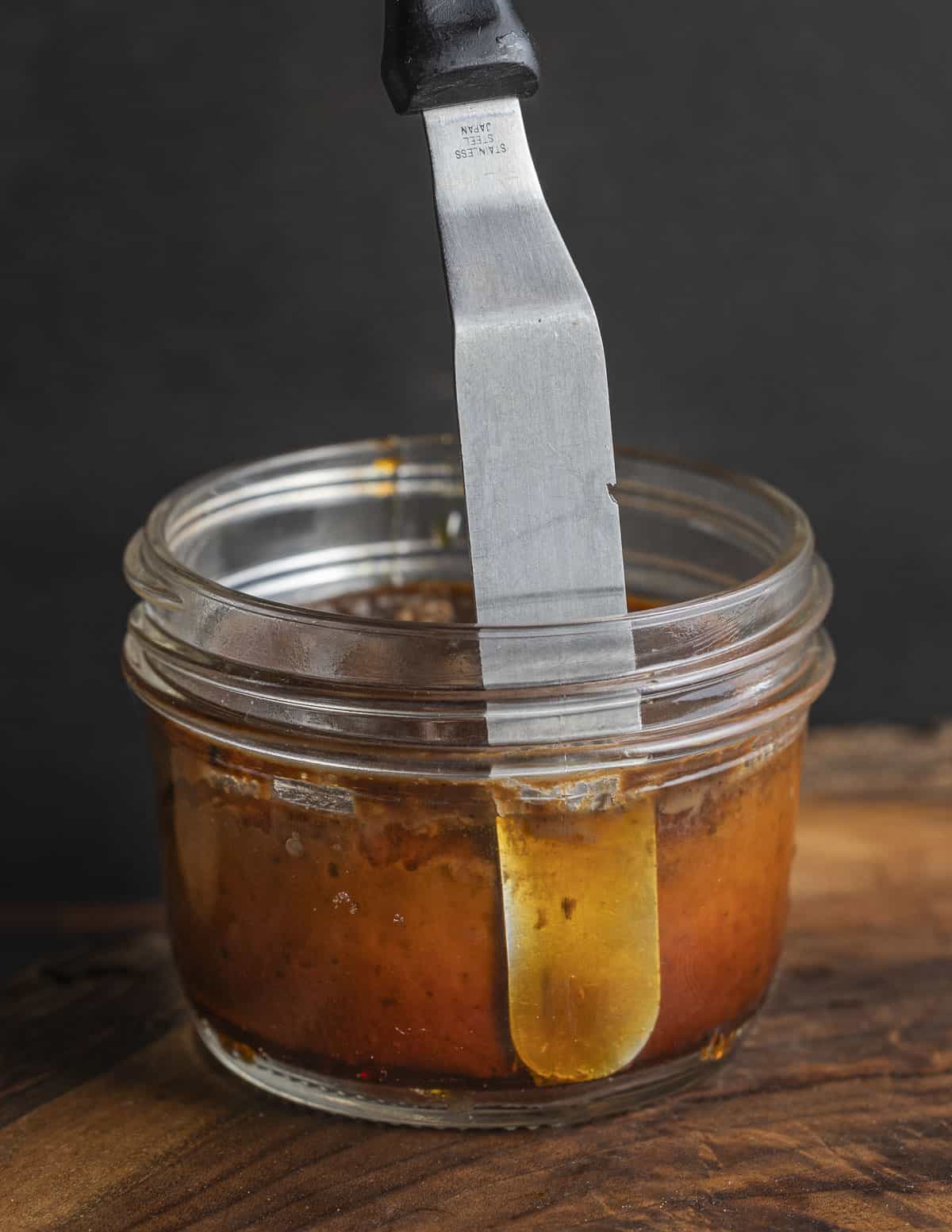 Unmolding an Italian bonet dessert using an offset spatula. 