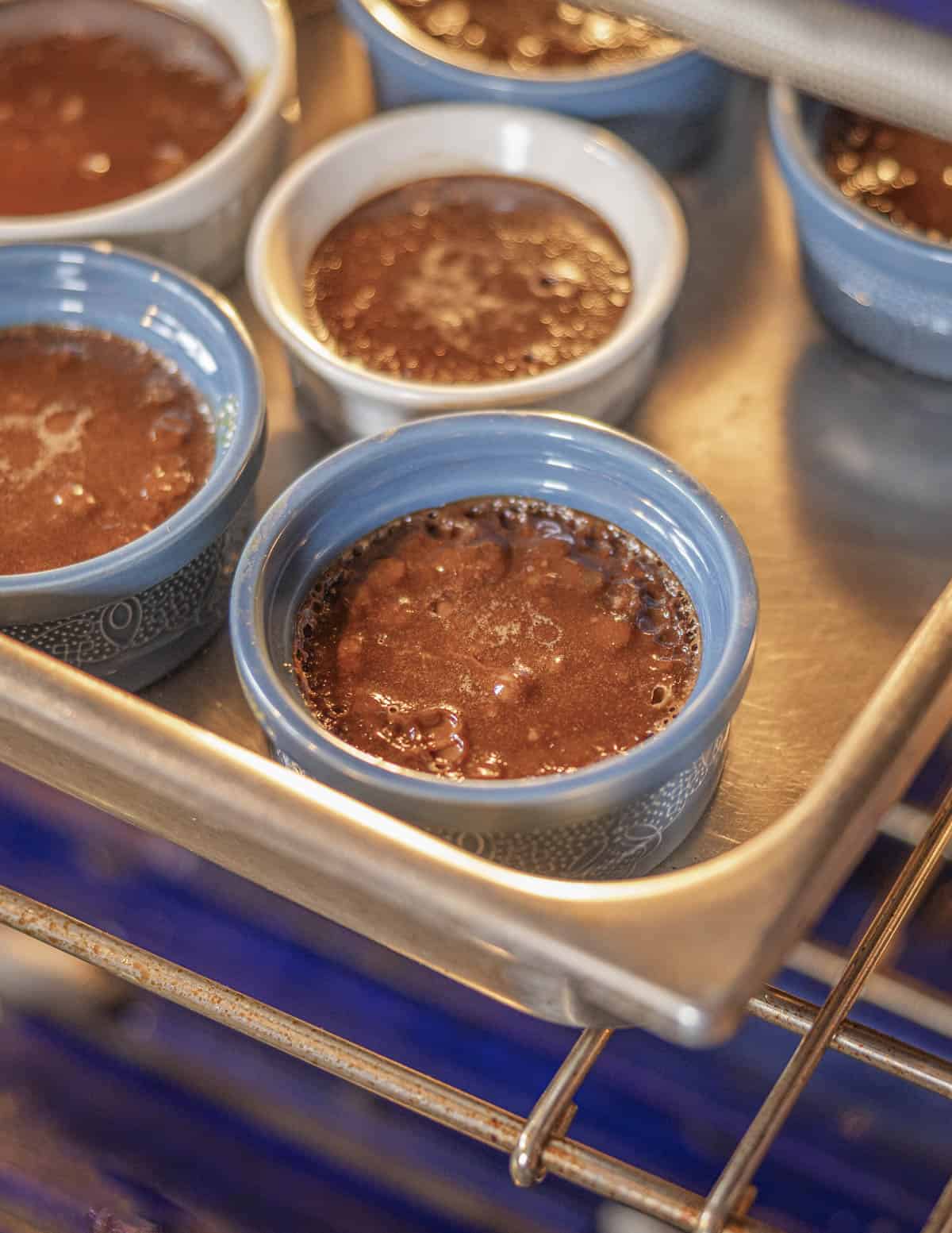 Baking Italian chocolate flans in a water bath in the oven. 