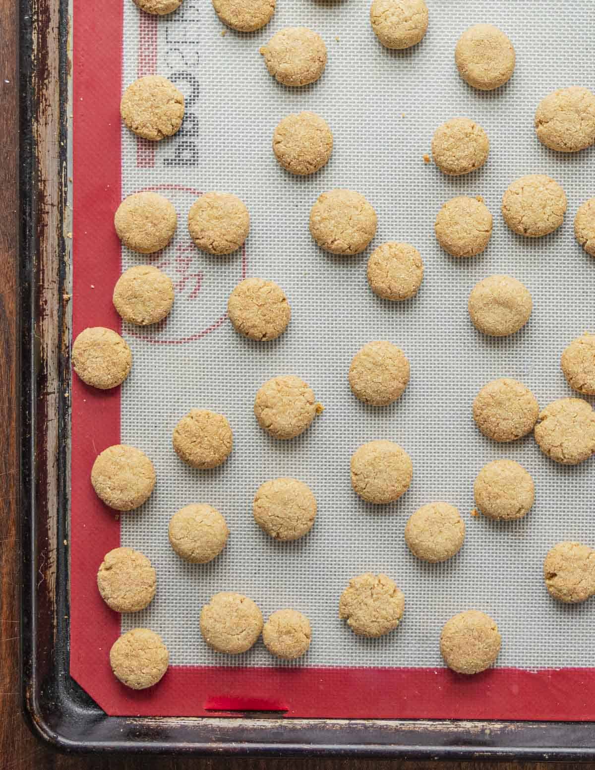 A pan of cooked homemade amaretti biscuit cookies. 