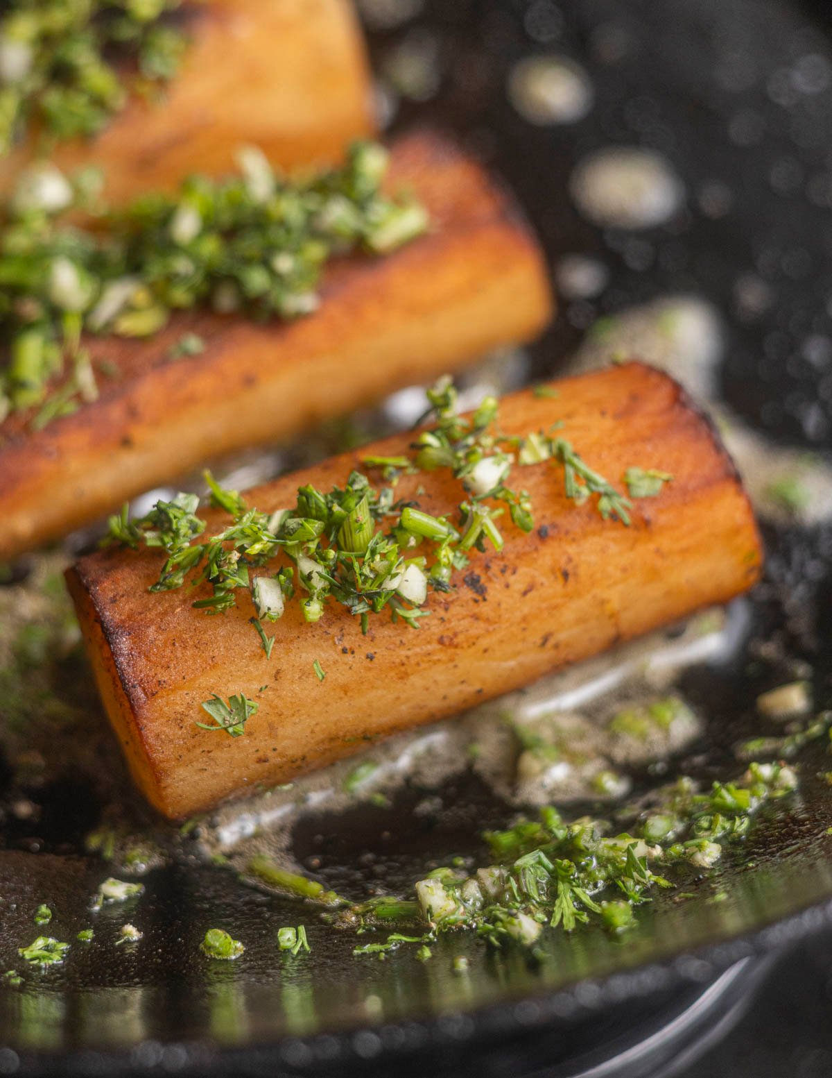 Pan fried salsify roots seasoned with minced garlic and parsley. 