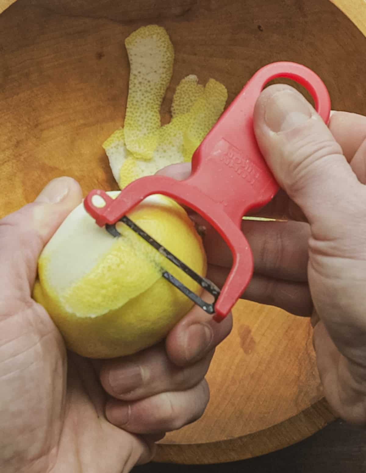 Peeling lemons with a Kuhn Rikon Y-shaped peeler. 