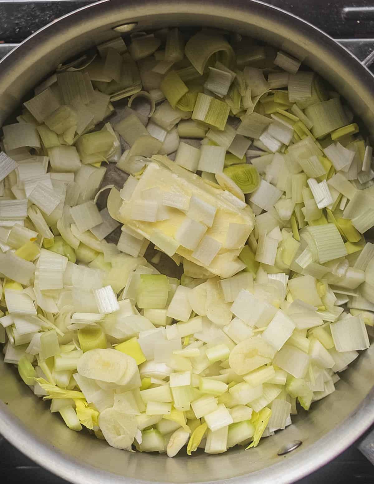 Cooking leek, onion and celery in butter for soup. 