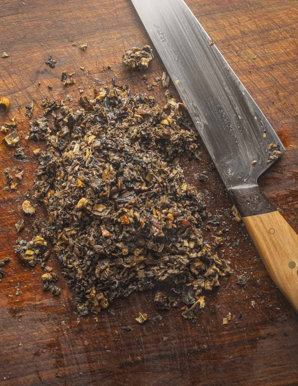 A pile of finely minced rehydrated mushrooms. 