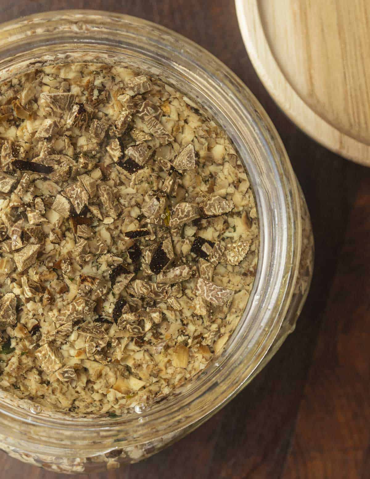 A top down image of a finished jar of mushroom tartufata truffle sauce. 