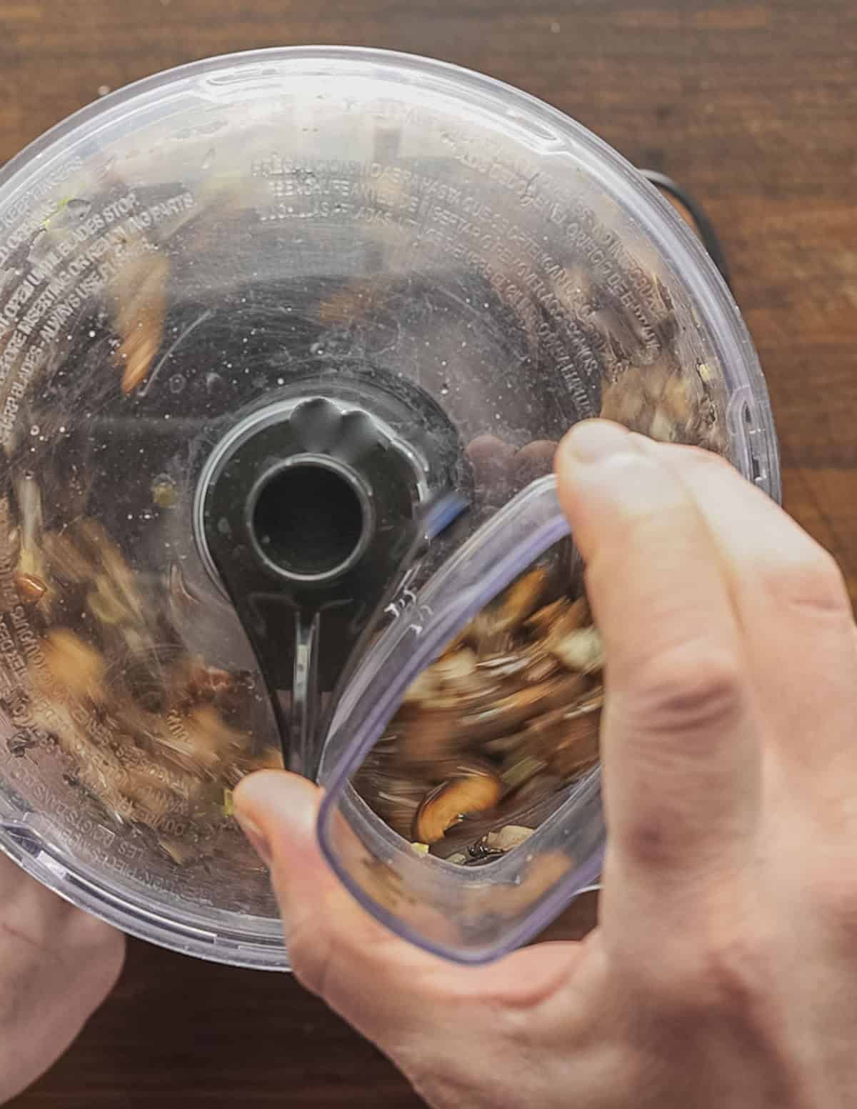 Pulsing cooked mushrooms in a food processor. 